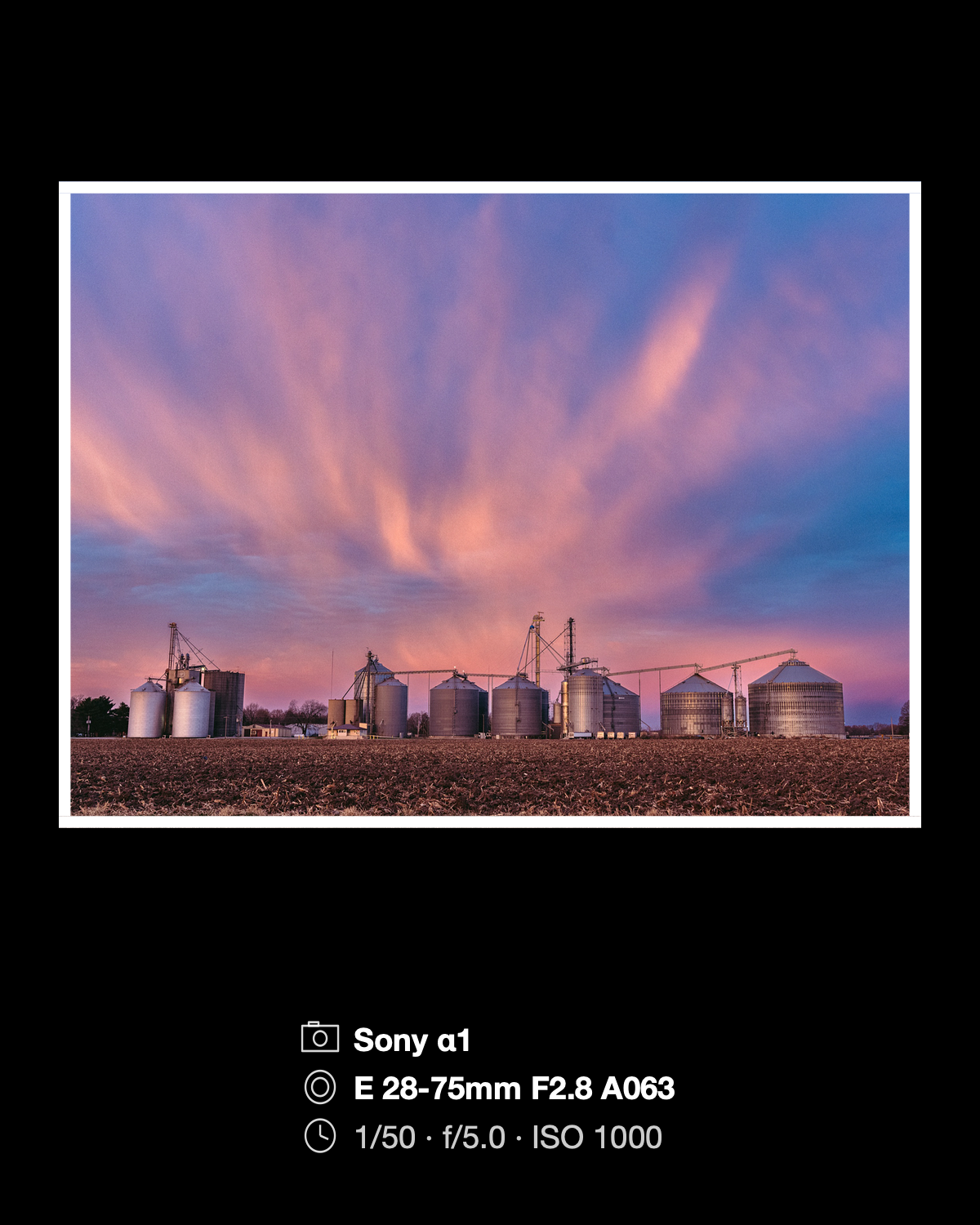 A sunset photograph on black with a white border and its real Sony α1 camera, lens, and exposure settings below