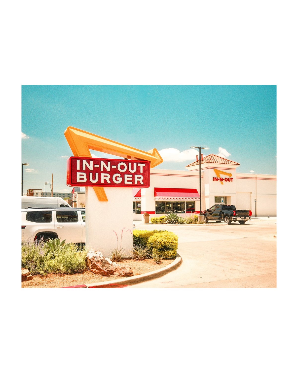 An In-N-Out Burger restaurant centered on a white background